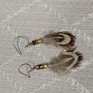 Gold feather earrings
